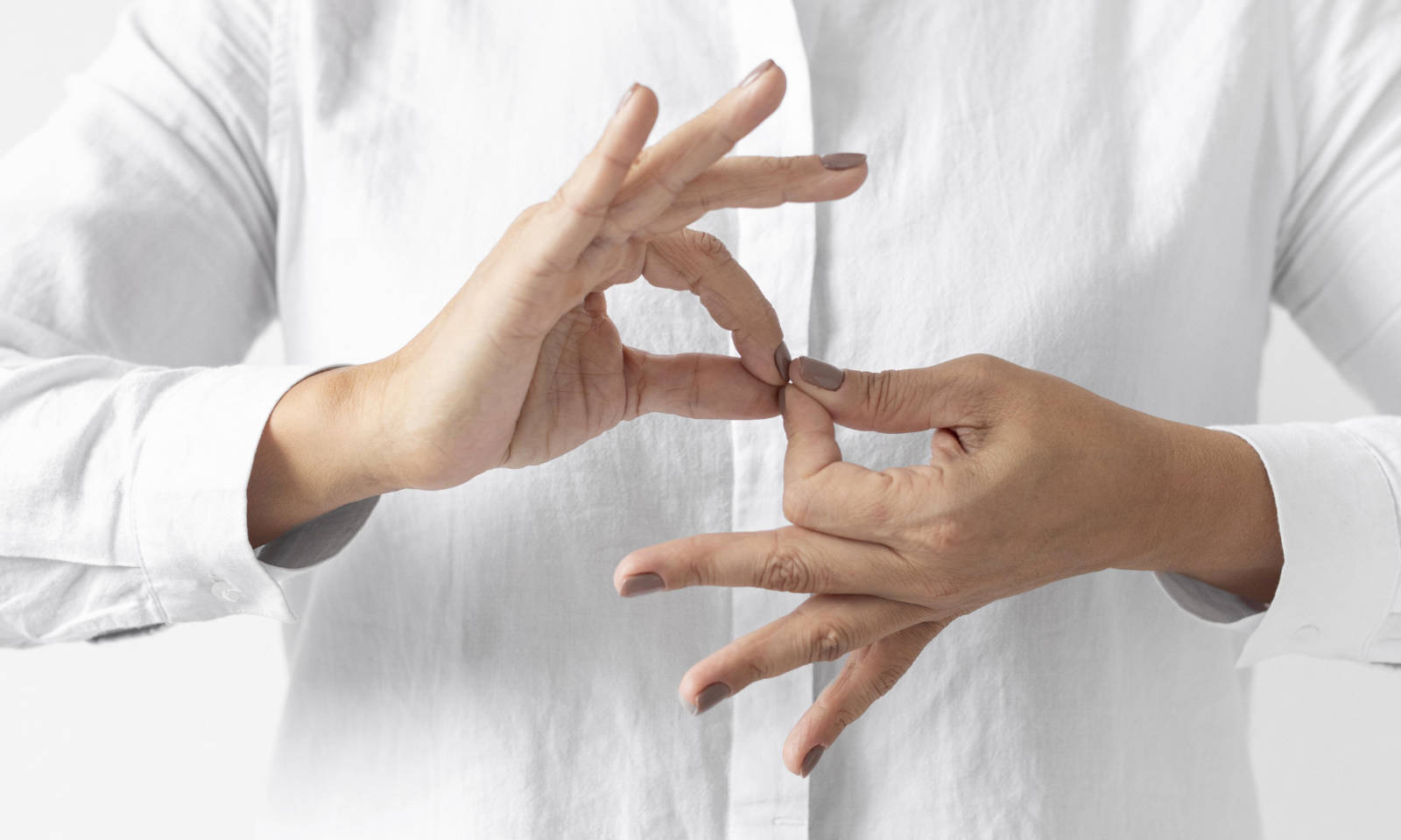 Two hands demonstrating sign language