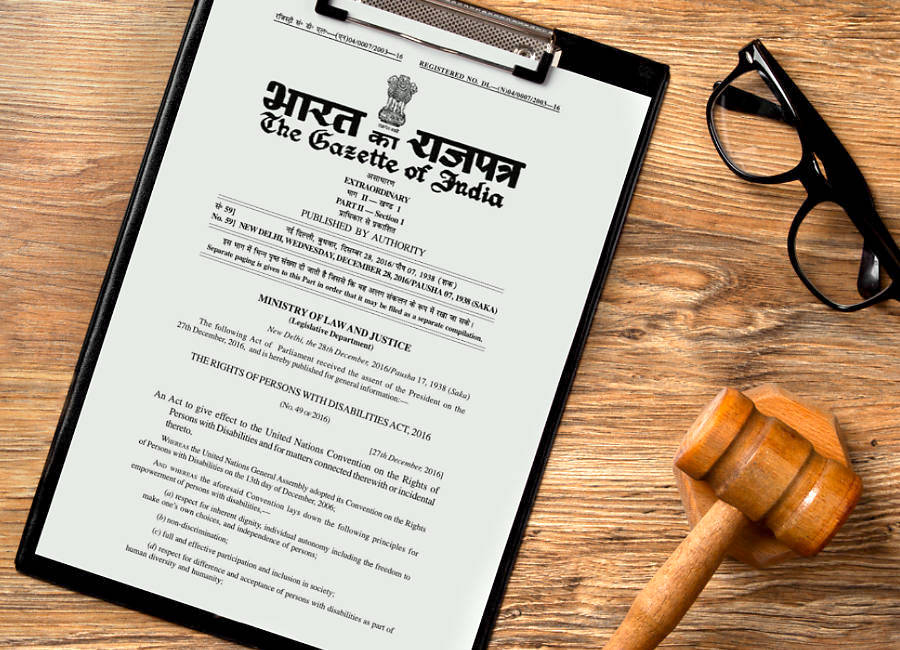 Physical copy of a legal document on a desk, along with a gavel and reading glasses